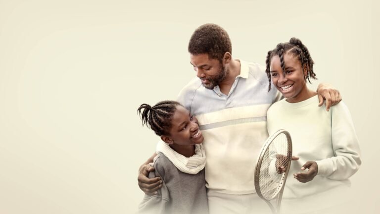 Father with his two daughters, smiling and embracing; the teen holds a tennis racket.