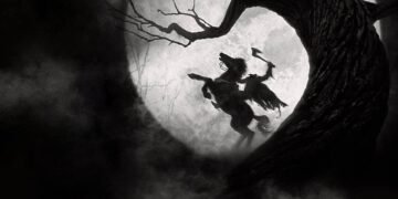 Two dark silhouettes clash with an axe inside a hollow tree against a bright circular background, like a moonlit scene in a forest.